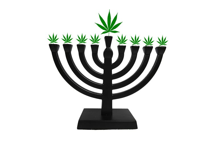 A menorah with marijuana leaves instead of candles