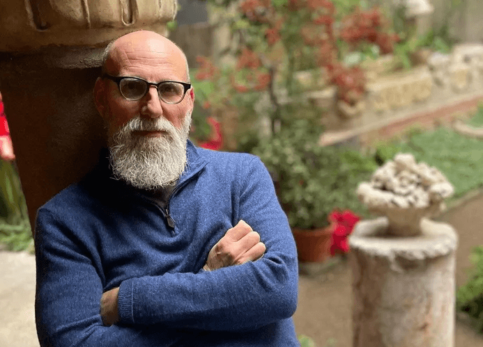 Bald man with beard, seated