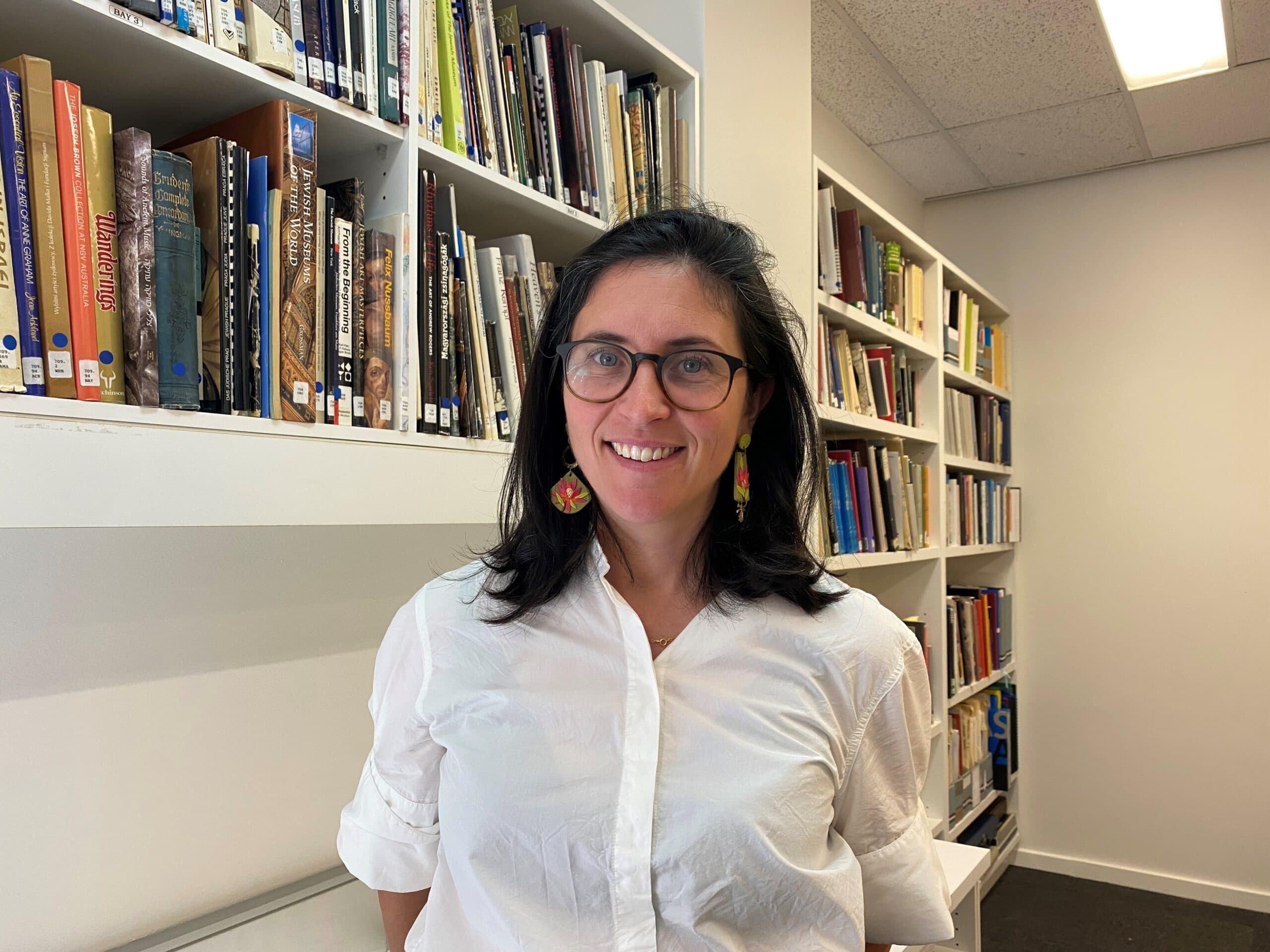 Head of collections and interpretation Esther Gyorki in the refreshed public library. (Image: Ruby Kraner-Tucci/The Jewish Independent)