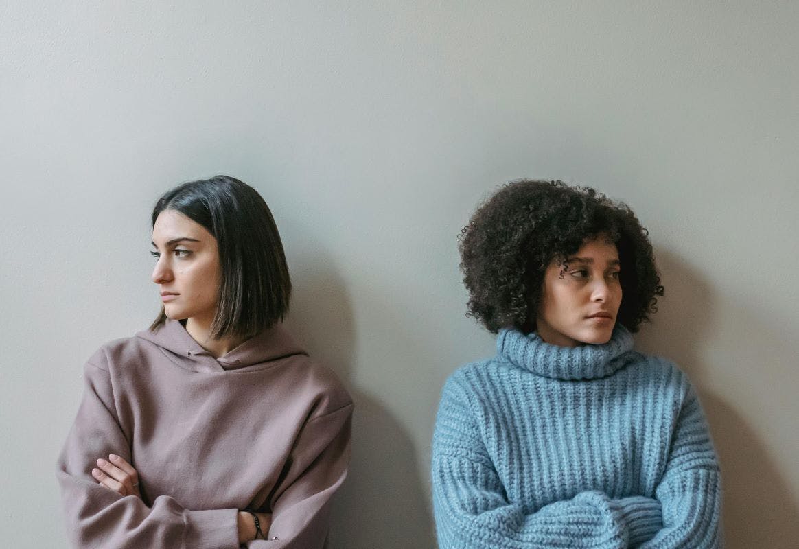 Two women looking away from one another