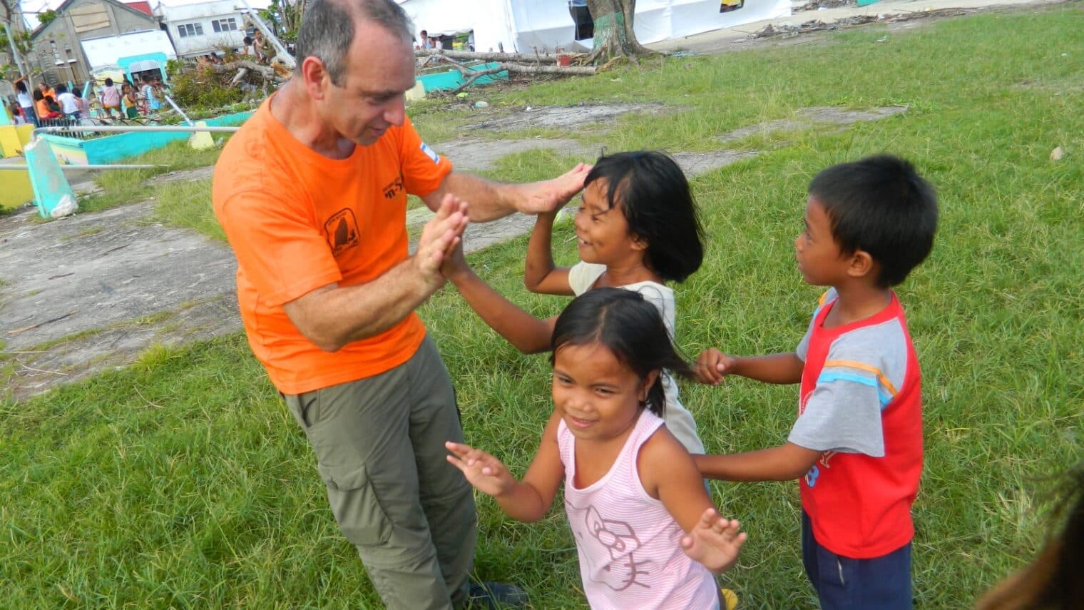 Man playing with children