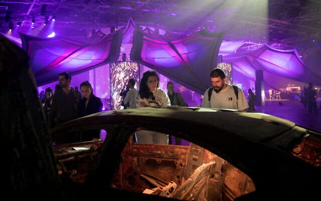 A burnt-out car from  an exhibition of objects collected from the Nova Party Massacre (Miriam Alster/Flash90/JTA) 