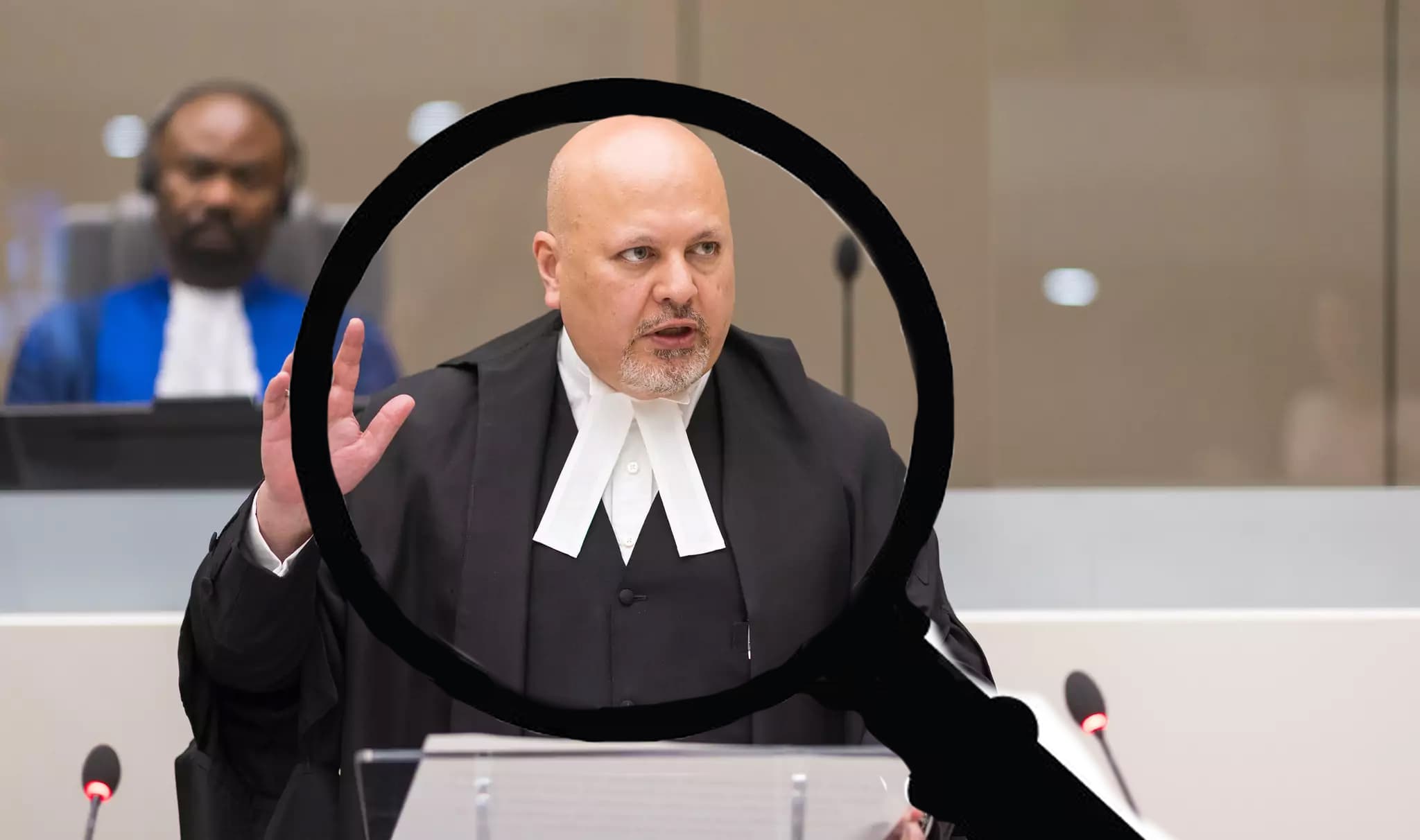 Man in lawyer's robes under magnifying glass