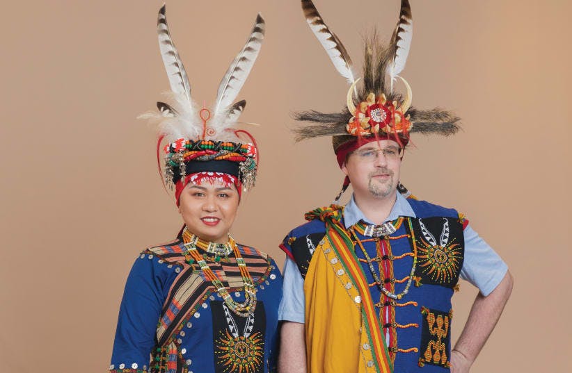A couple dressed in traditional Indigenous attire from Taiwan