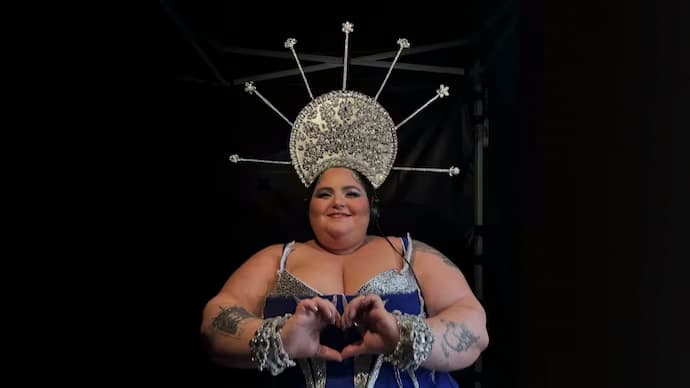 Fat tatooed woman wearing halo headdress