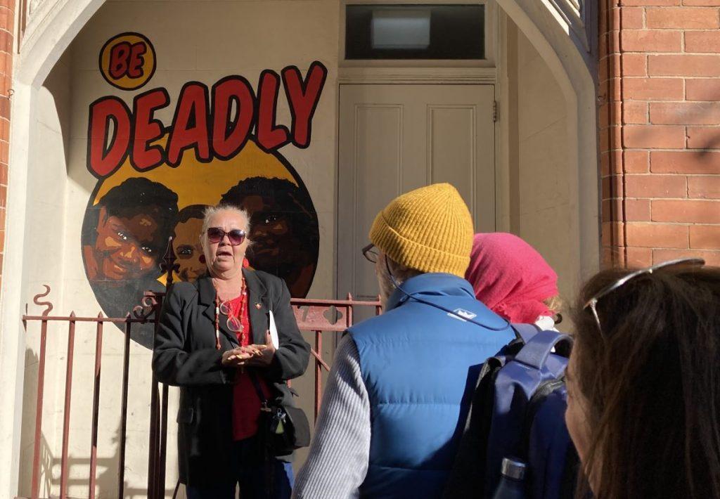 Tour participants learn about the history of Redfern