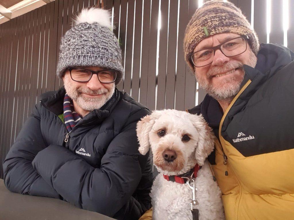 Michael (LHS) with husband Gregory and "special dog" Buddy (Image: supplied).