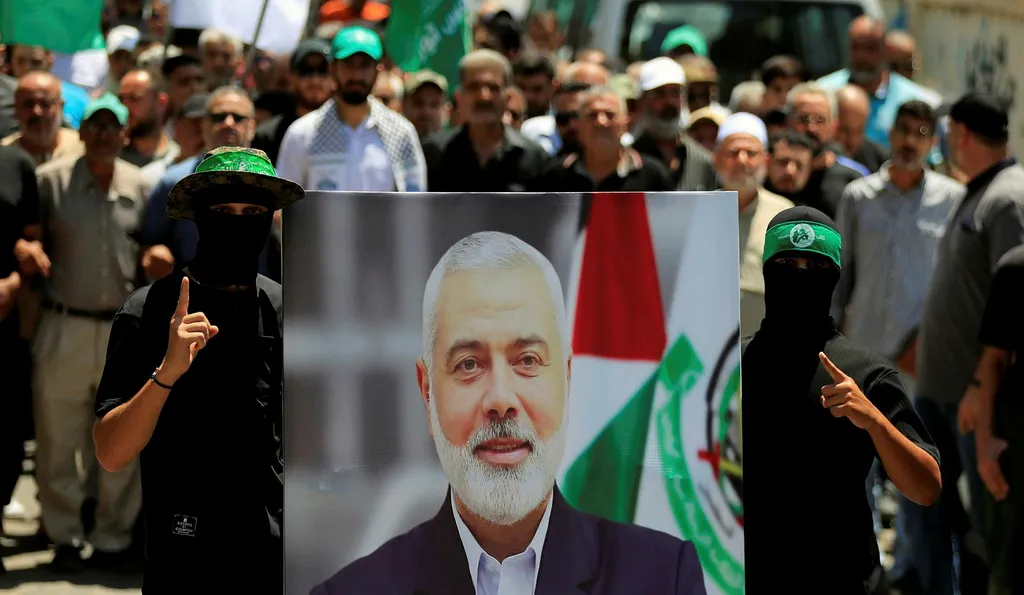 Poster of a bearded man held by a crowd of people in green caps