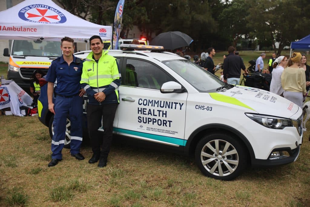 Lenn with the NSW ambulance at a recent CPR day held by Community Health Support (Image: supplied).