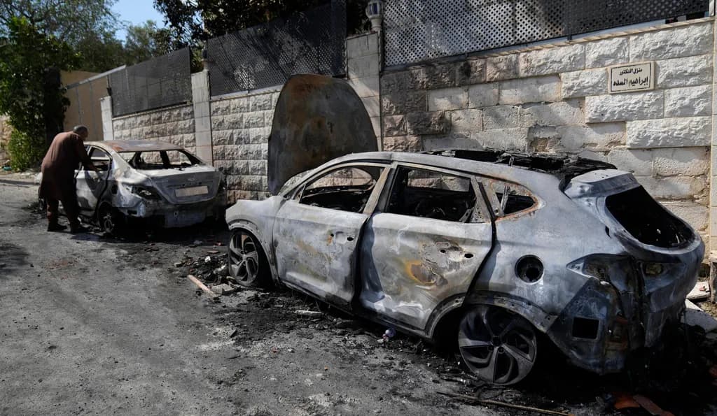 Burned out cars belonging to Palestinians, after riots by Israeli settlers in the West Bank, earlier this year (Nasser Nasser/AP).