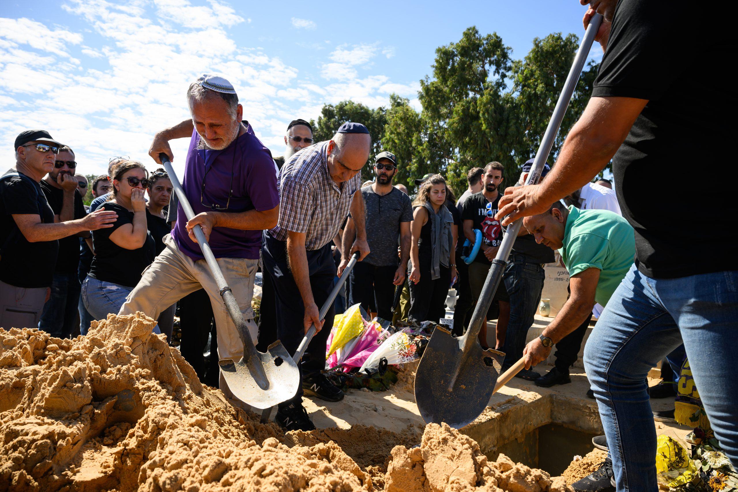 Men diging a grave