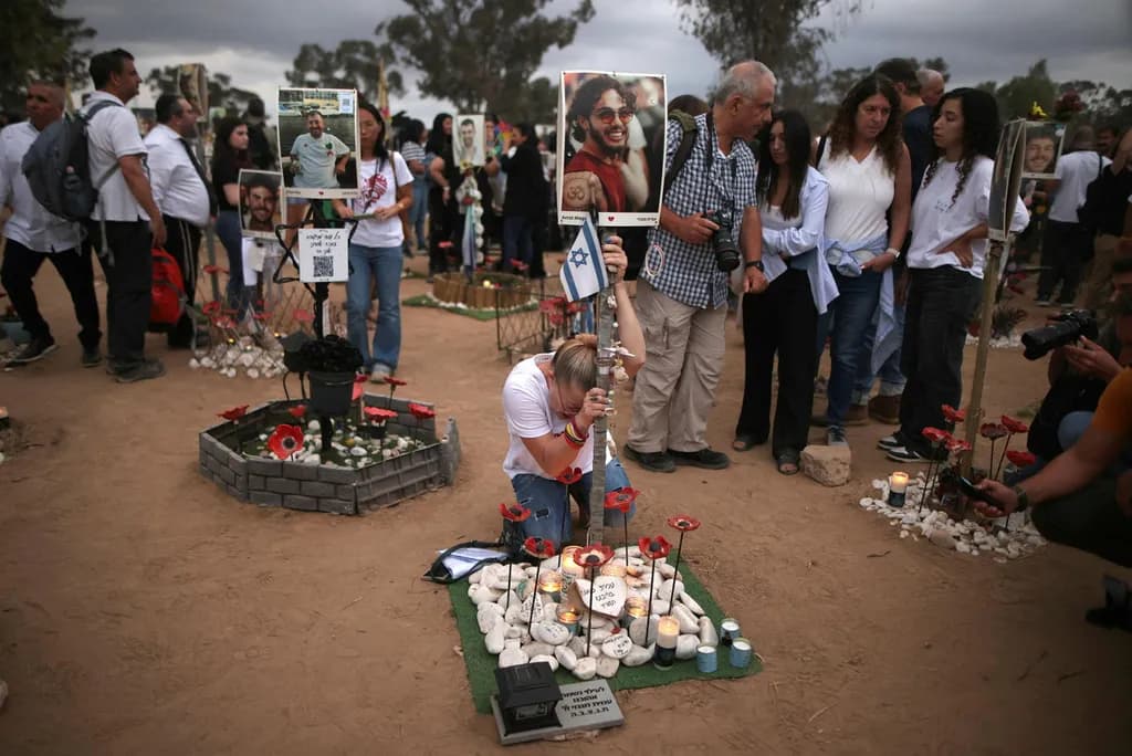 Mourners gathered at the site of the Nova Music Festival massacre on Monday (Ilan Assayag, Haaretz).