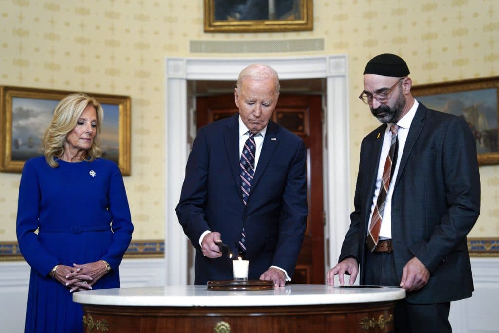 US President Joe Biden with first lady Jill Biden light a yahrzeit candle lighting at the White House in Washington on October 7, 2024 (Yuri Gripas/ABACAPRESS.COM).