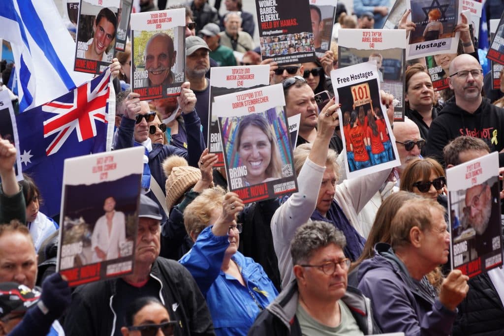 Hostage photos at Melbourne city vigil (Ben Bresley)