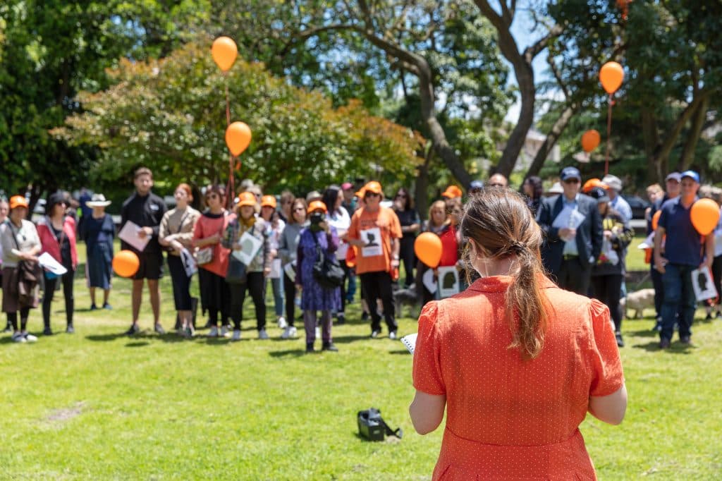 Barrett (back to camera) addressing Jewish community members participating in the Walk Against Family Violence (Image: supplied).