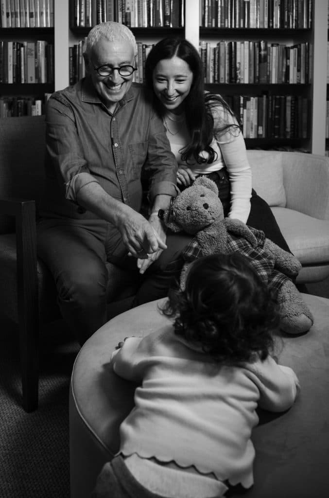 Mark Baker and Michelle Lesh playing with their daughter Melila