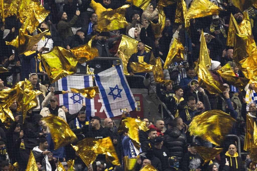 2 Israeli flags in a sea of yellow flags