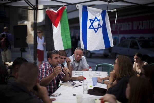 Palestinians and Israelis discuss peace-building in Jerusalem,  August 2013. (Yonatan Sindel/Flash90)