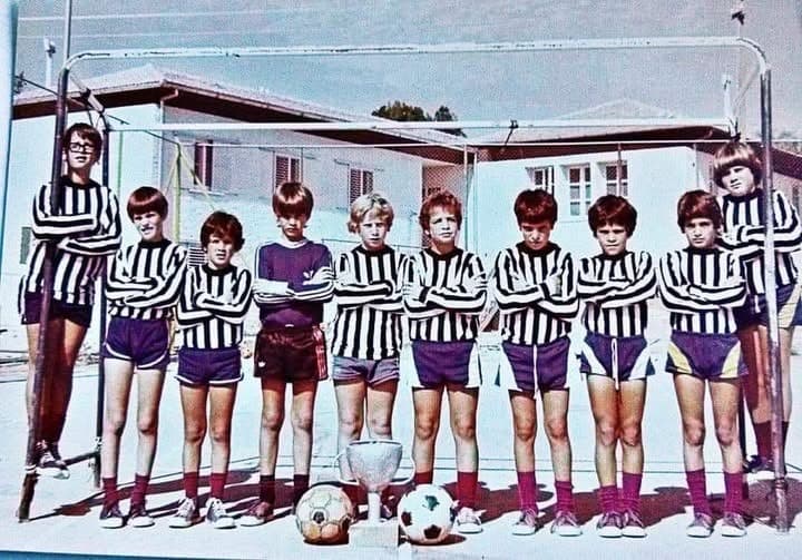 A group of children in soccer uniforms