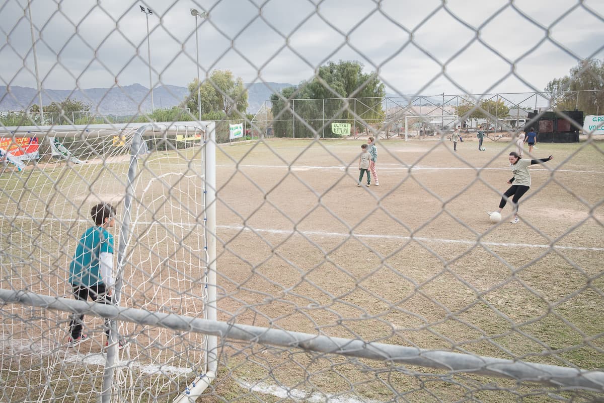 Children from Kibbutz Ketura playing football on the settlement's field