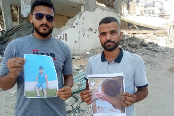 Activists holding photos of Israeli children killed by Hamas (Image: Gaza Youth Committee).