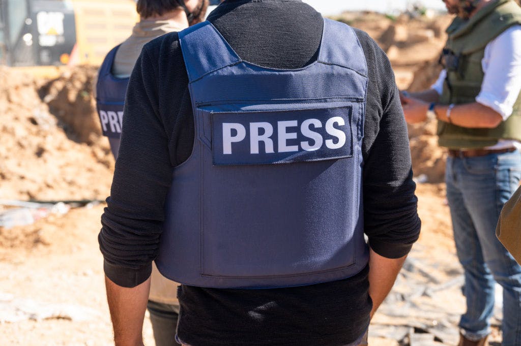 Man in press vest