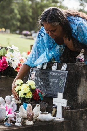 Rebecca Stadhams at the gravesite of her daughter Evelyn, who was murdered aged four in 1990 (Kate Holmes)